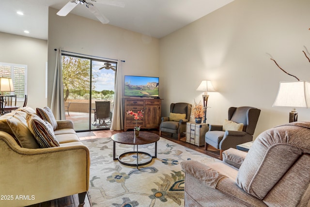 living area with a ceiling fan, wood finished floors, and recessed lighting