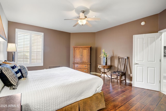 bedroom with dark wood-style floors, baseboards, and a ceiling fan