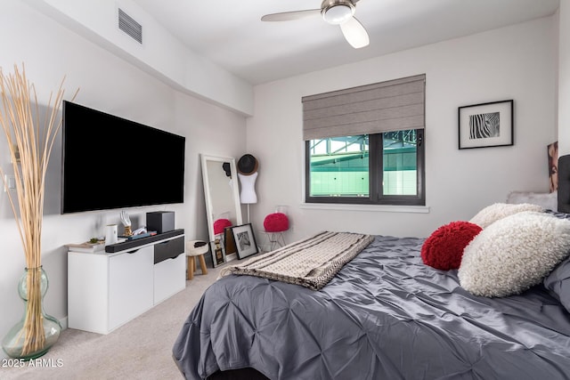 bedroom featuring light carpet and ceiling fan