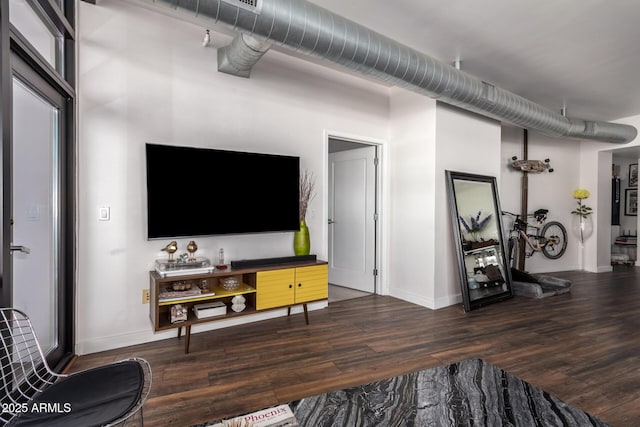 living room featuring dark wood-type flooring