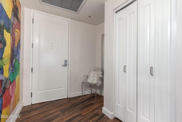 entrance foyer featuring dark wood-type flooring