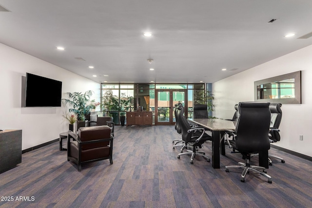 office area featuring a wall of windows, french doors, and dark carpet