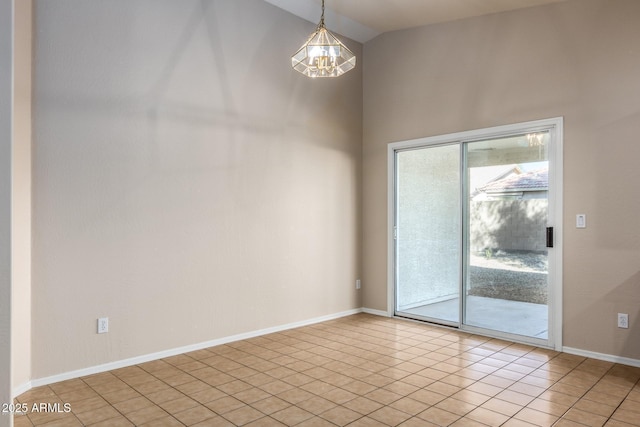 empty room featuring an inviting chandelier, light tile patterned flooring, and vaulted ceiling