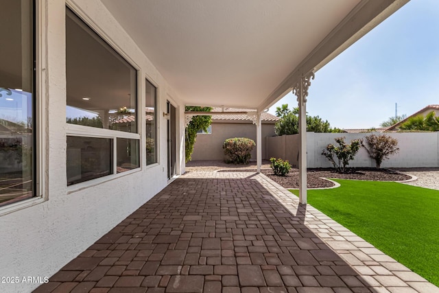 view of patio featuring fence