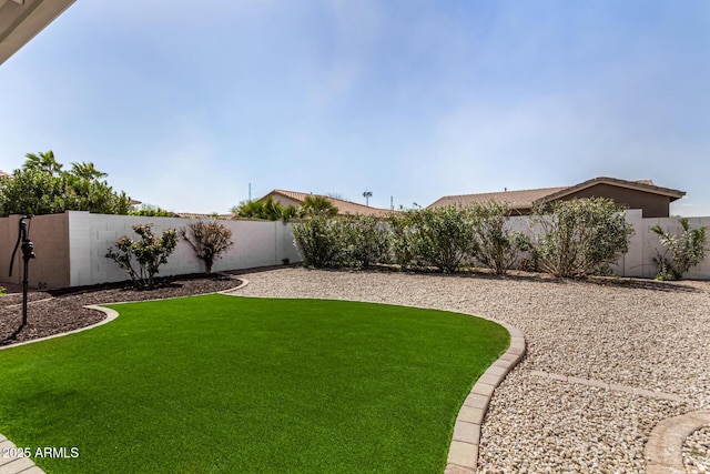 view of yard featuring a fenced backyard