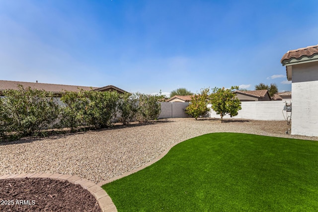 view of yard with a fenced backyard