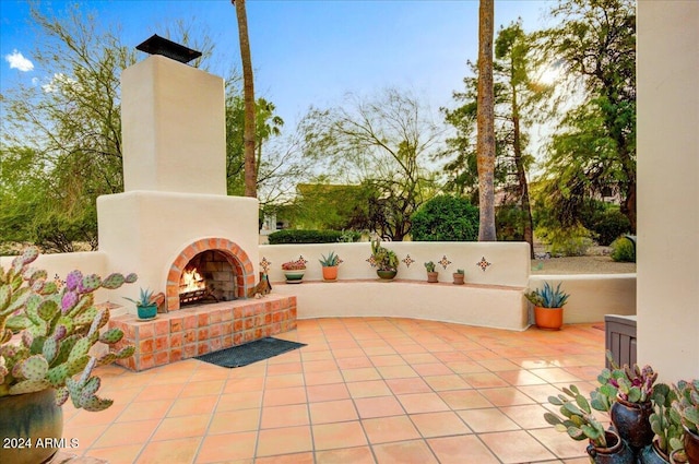 view of patio / terrace with an outdoor brick fireplace