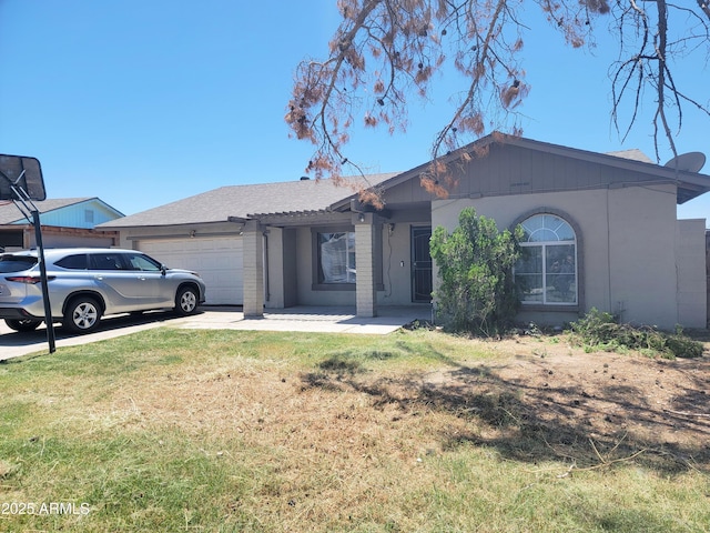 7525 W Turney Ave, Phoenix, AZ 85033 - ranch-style home featuring a garage, a front lawn, and driveway