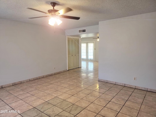 7525 W Turney Ave, Phoenix, AZ 85033 - spare room with a ceiling fan, a textured ceiling, baseboards, and light tile patterned floors