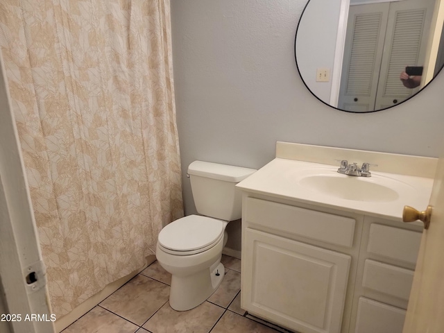 7525 W Turney Ave, Phoenix, AZ 85033 - bathroom with toilet, vanity, and tile patterned floors
