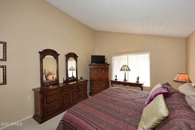 bedroom with baseboards, light carpet, and lofted ceiling