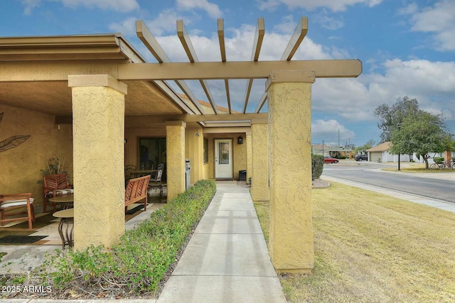 doorway to property with stucco siding