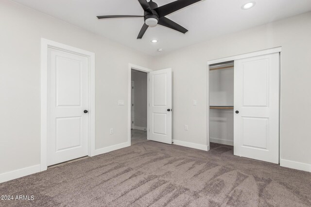 unfurnished bedroom featuring carpet flooring and ceiling fan