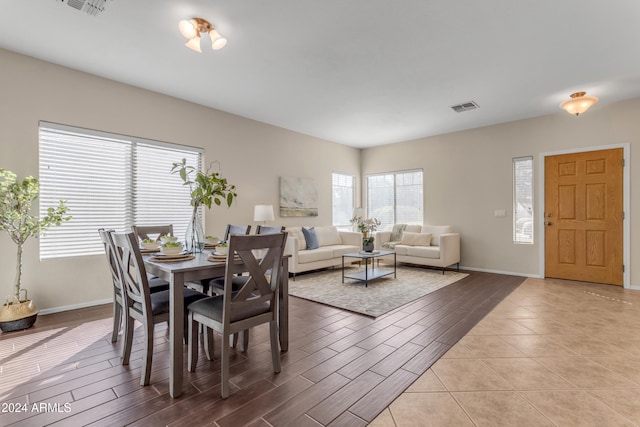 dining area with light hardwood / wood-style floors