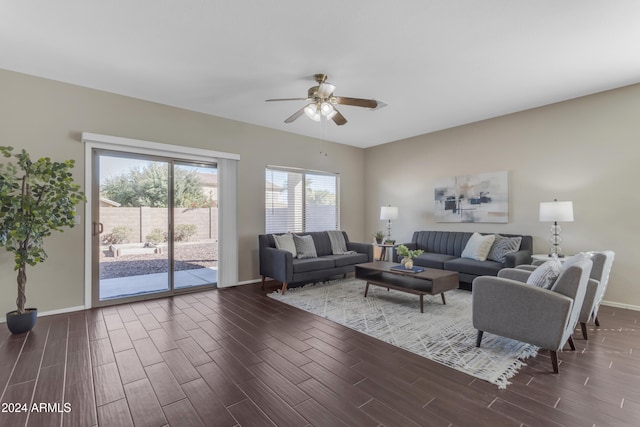 living room with ceiling fan and dark hardwood / wood-style floors