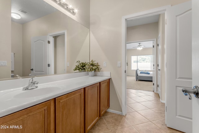 bathroom featuring vanity, tile patterned floors, and ceiling fan