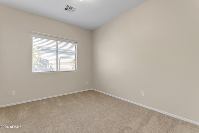 empty room with light colored carpet