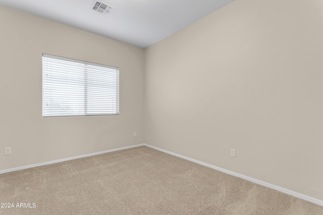 empty room featuring light carpet