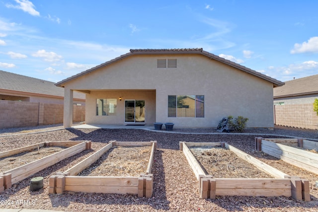 back of property featuring a patio