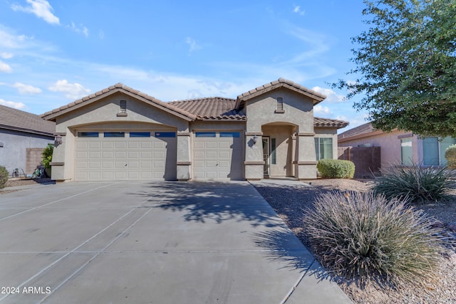 mediterranean / spanish-style house featuring a garage