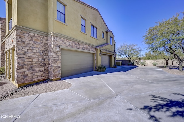 view of property exterior featuring a garage