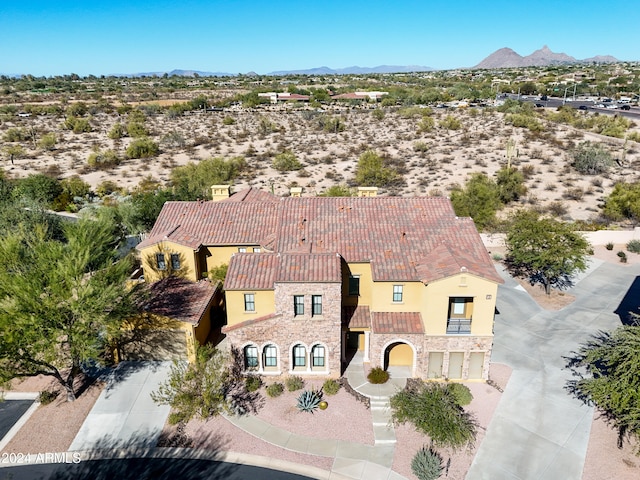 birds eye view of property featuring a mountain view