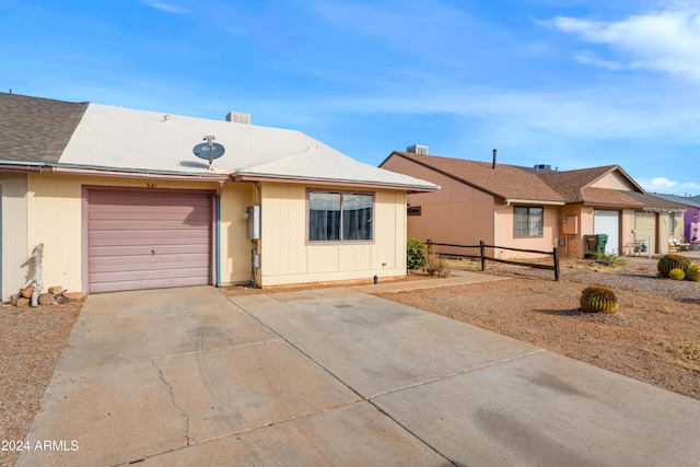 ranch-style home featuring a garage