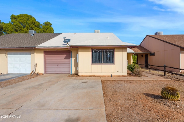 ranch-style home featuring a garage