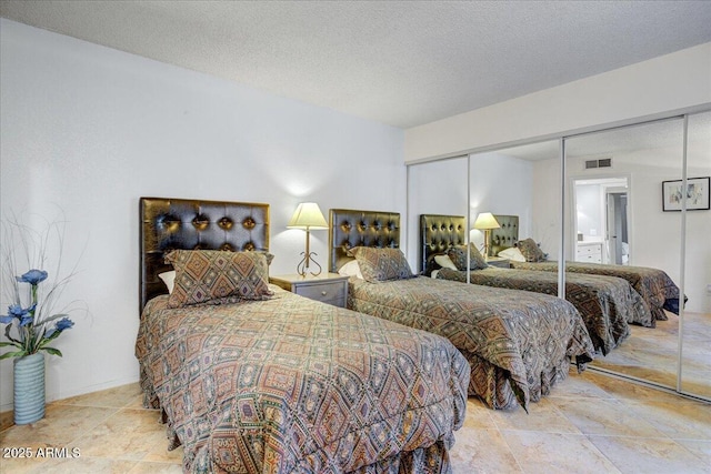 9450 N 94th Pl Unit 106, Scottsdale, AZ 85258 - bedroom with a closet and a textured ceiling