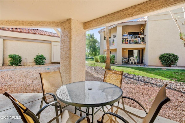9450 N 94th Pl Unit 106, Scottsdale, AZ 85258 - view of patio with outdoor dining area and a balcony