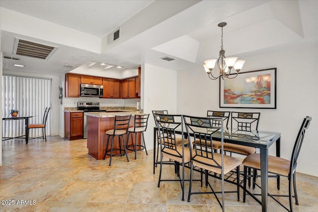 9450 N 94th Pl Unit 106, Scottsdale, AZ 85258 - dining space with a chandelier