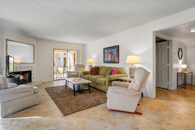 9450 N 94th Pl Unit 106, Scottsdale, AZ 85258 - living area with a textured ceiling and a fireplace