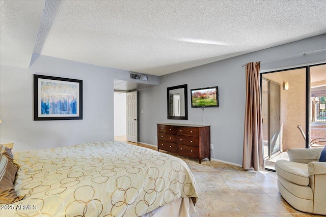 9450 N 94th Pl Unit 106, Scottsdale, AZ 85258 - bedroom featuring access to outside, a textured ceiling, and baseboards