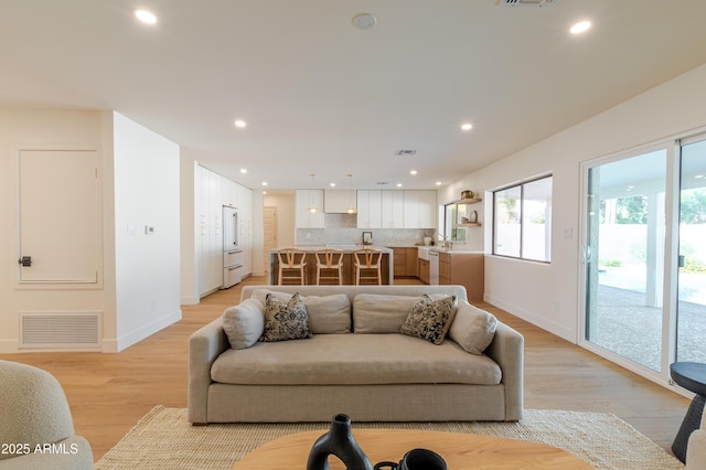 7127 N 79th St, Scottsdale, AZ 85258 - living area with light wood-style flooring, baseboards, and recessed lighting