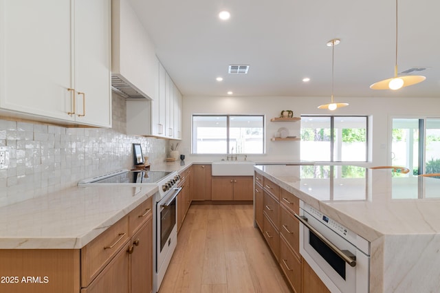 7127 N 79th St, Scottsdale, AZ 85258 - kitchen featuring range with electric stovetop, a sink, open shelves, light wood-type flooring, and white oven