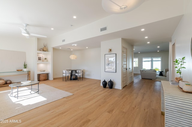 7127 N 79th St, Scottsdale, AZ 85258 - living area featuring light wood finished floors, recessed lighting, built in features, and baseboards