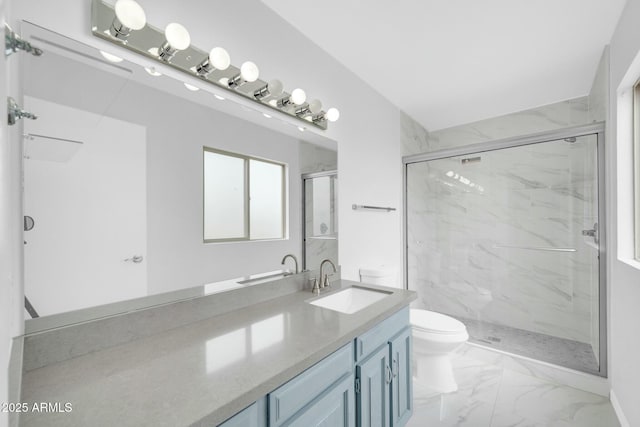 bathroom featuring toilet, marble finish floor, a marble finish shower, and vanity