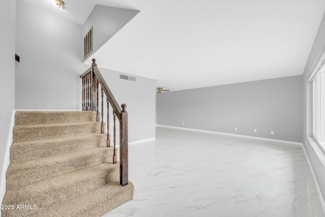 stairs featuring marble finish floor, visible vents, and baseboards