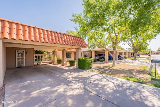 602 E Colgate Dr, Tempe, AZ 85283 - view of front of home with a tile roof, stucco siding, concrete driveway, and a carport