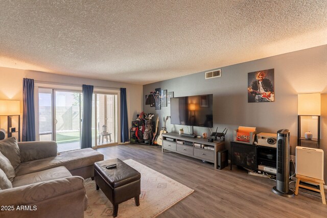 602 E Colgate Dr, Tempe, AZ 85283 - living area featuring wood finished floors and a textured ceiling