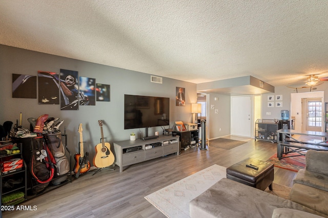 602 E Colgate Dr, Tempe, AZ 85283 - living room with a textured ceiling, wood finished floors, and ceiling fan