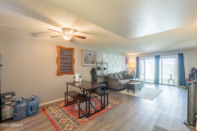 602 E Colgate Dr, Tempe, AZ 85283 - living room with a textured ceiling, wood finished floors, a ceiling fan, and baseboards