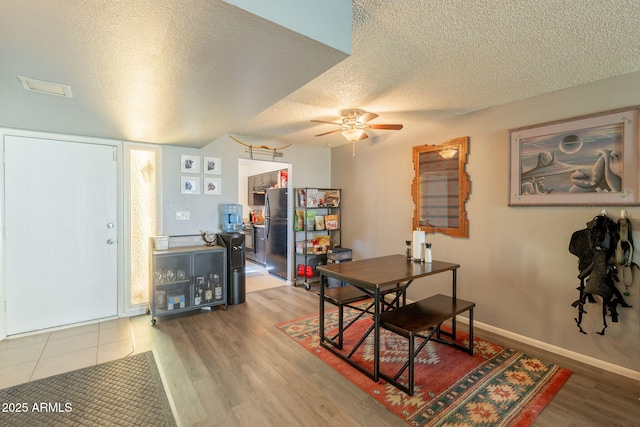 602 E Colgate Dr, Tempe, AZ 85283 - dining area with a textured ceiling, ceiling fan, wood finished floors, and baseboards
