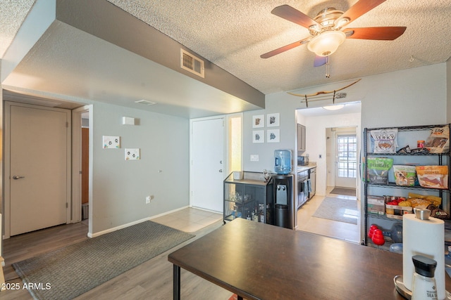 602 E Colgate Dr, Tempe, AZ 85283 - kitchen featuring a textured ceiling, light wood-style flooring, ceiling fan, and baseboards