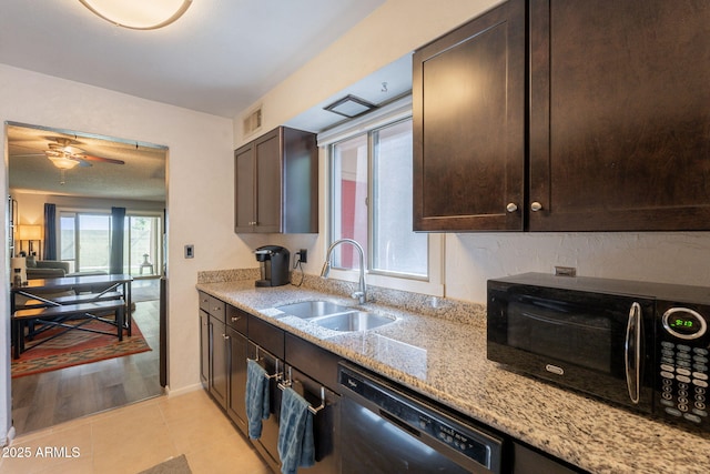 602 E Colgate Dr, Tempe, AZ 85283 - kitchen featuring black appliances, a sink, dark brown cabinets, and light stone counters