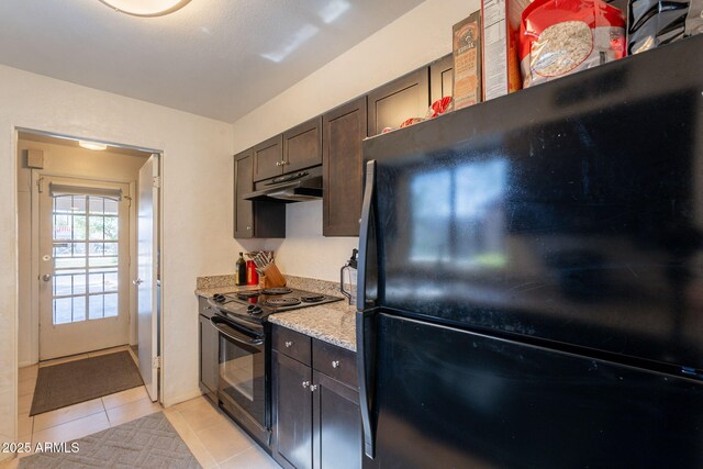 602 E Colgate Dr, Tempe, AZ 85283 - kitchen with black appliances, under cabinet range hood, light tile patterned floors, and dark brown cabinets