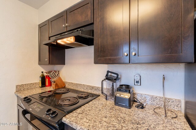 602 E Colgate Dr, Tempe, AZ 85283 - kitchen with black / electric stove, under cabinet range hood, dark brown cabinetry, and light stone counters