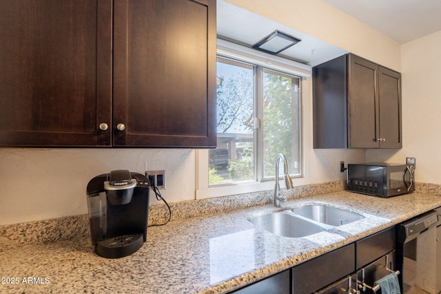 602 E Colgate Dr, Tempe, AZ 85283 - kitchen with black microwave, a sink, dark brown cabinetry, light stone counters, and dishwasher