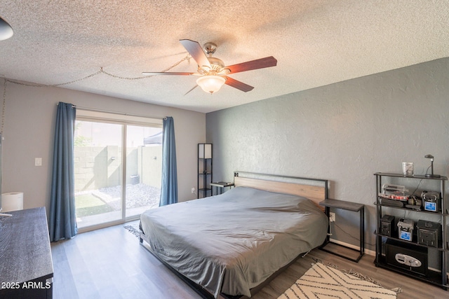 602 E Colgate Dr, Tempe, AZ 85283 - bedroom featuring a textured wall, a textured ceiling, access to exterior, wood finished floors, and ceiling fan