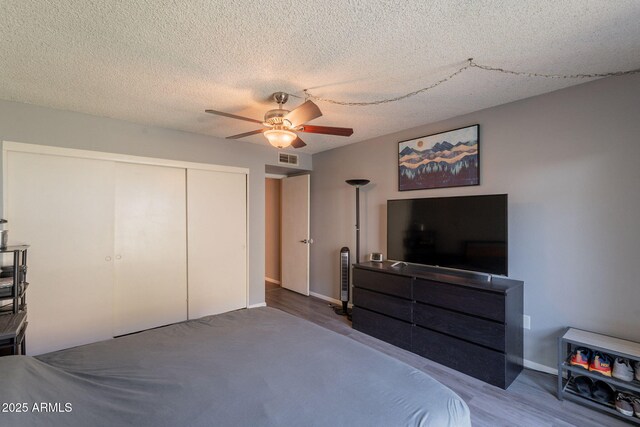 602 E Colgate Dr, Tempe, AZ 85283 - bedroom featuring a closet, a ceiling fan, baseboards, and wood finished floors